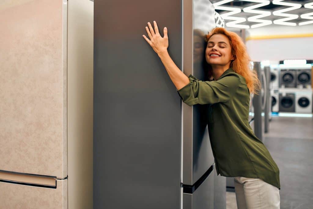 woman hugging freezer