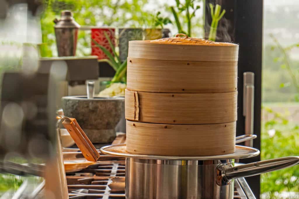 bamboo steamer on top of boiling water