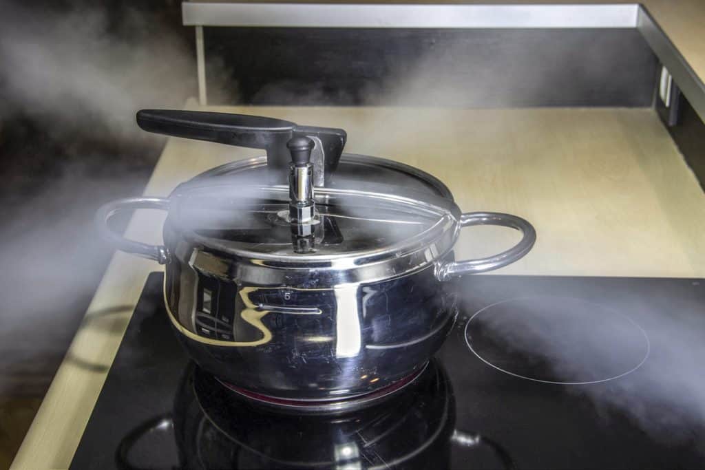 steam coming out of side of pressure cooker