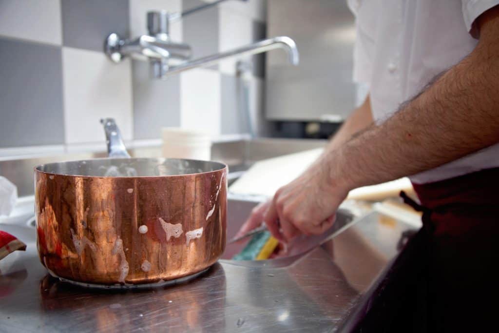 wash copper pan by hand